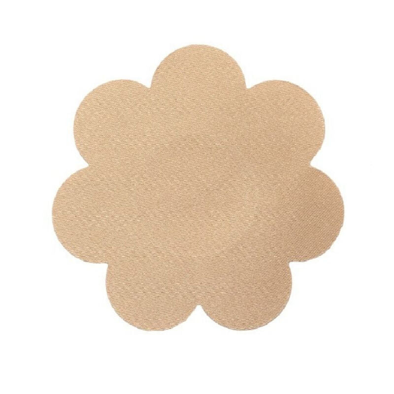 Cache-téton Bye Bra en tissu beige en forme de fleur, posé à plat